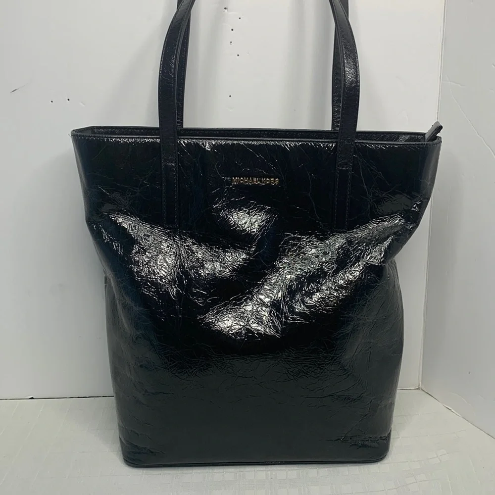 Michael Kors a black Vertical Tote.